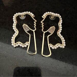 Elegant Gold and Pearl Silhouette Earrings